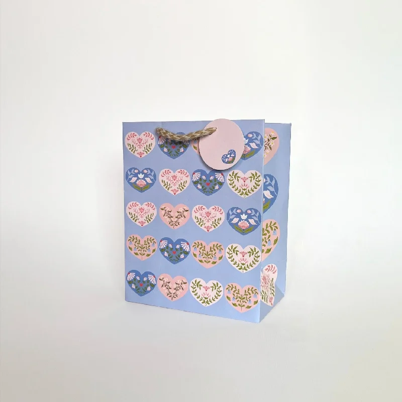 Colorful paper shopping and gift bags with intricate embossed patterns for party favorsHearts Medium Gift Bags Colorful paper shopping and gift bags with intricate embossed patterns for party favorsHearts Medium Gift Bags