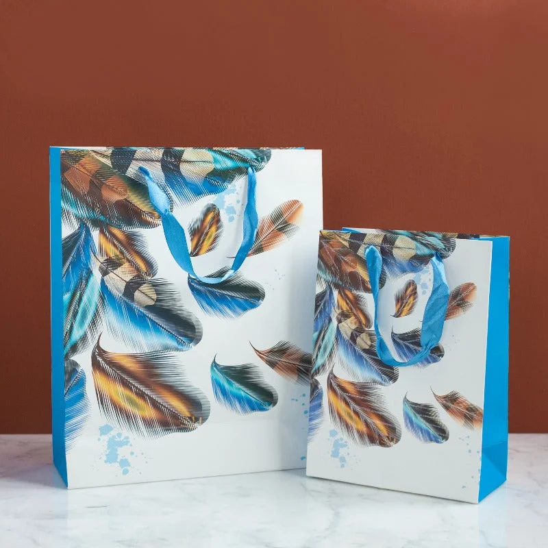 Luxury leather shopping and gift bags with gold - plated hardware for high - end presentsBlue Feathers Gift Bag (Set of 4) Luxury leather shopping and gift bags with gold - plated hardware for high - end presentsBlue Feathers Gift Bag (Set of 4)
