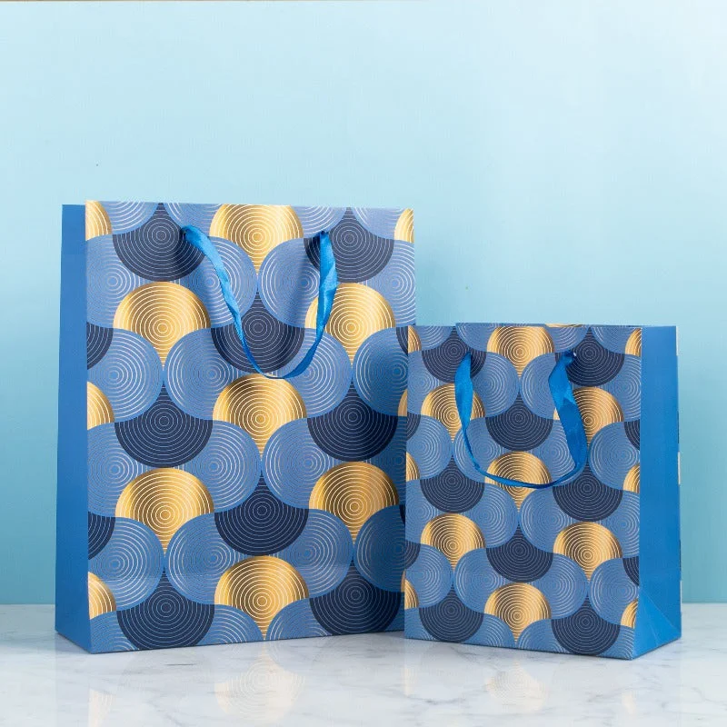 Retro - inspired shopping and gift bags with a bold color palette for nostalgiaGolden Whirl Gift Bag (Set of 4) Retro - inspired shopping and gift bags with a bold color palette for nostalgiaGolden Whirl Gift Bag (Set of 4)