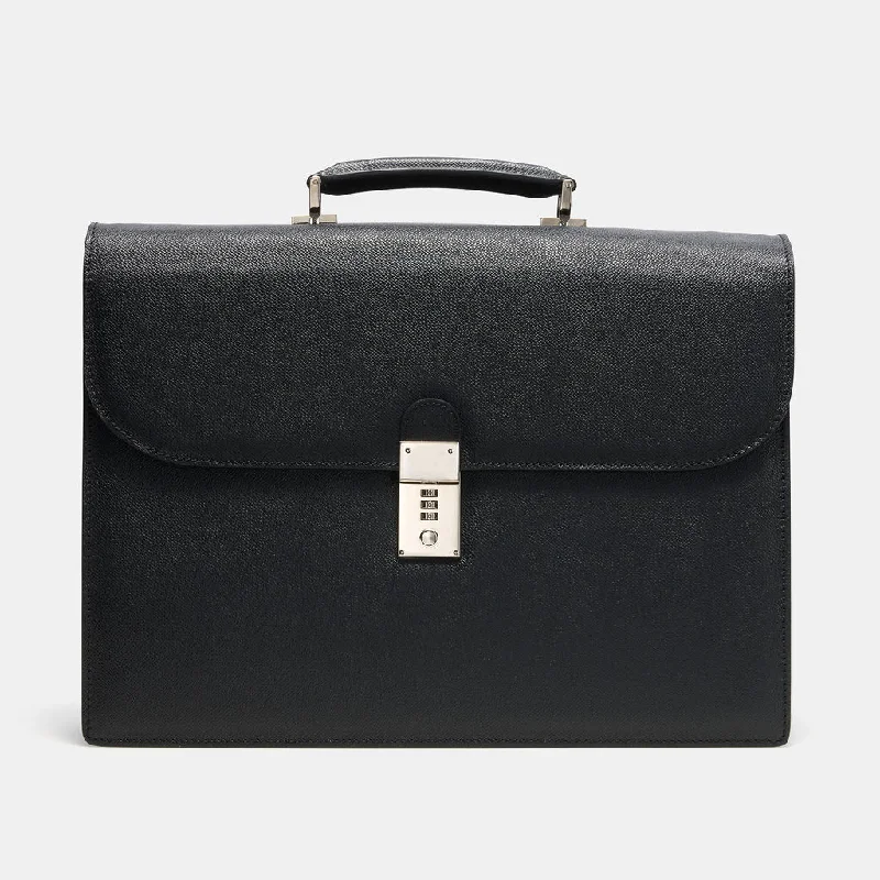 Compact carry - on travel bag with spinner wheels for easy maneuvering in airportsGRAINED LEATHER FLAP BRIEF Compact carry - on travel bag with spinner wheels for easy maneuvering in airportsGRAINED LEATHER FLAP BRIEF