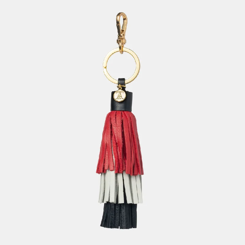 Vintage leather travel bag with brass accents for a classic and sophisticated lookHANDBAG TASSEL 3-TIERED COLOR Vintage leather travel bag with brass accents for a classic and sophisticated lookHANDBAG TASSEL 3-TIERED COLOR