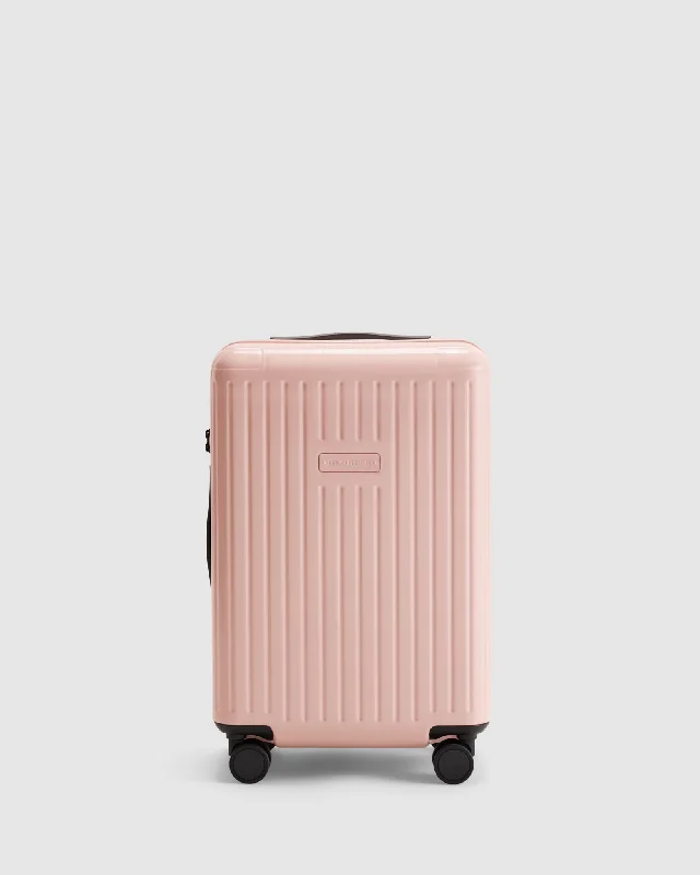 Vintage leather travel bag with brass accents for a classic and sophisticated lookCarry On Expandable Suitcase - Whisper Pink Vintage leather travel bag with brass accents for a classic and sophisticated lookCarry On Expandable Suitcase - Whisper Pink