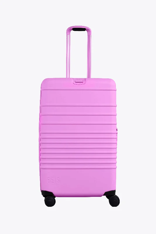 Stackable travel bag set with various sizes for diverse packing needsThe Medium Check-In Roller in Berry Stackable travel bag set with various sizes for diverse packing needsThe Medium Check-In Roller in Berry