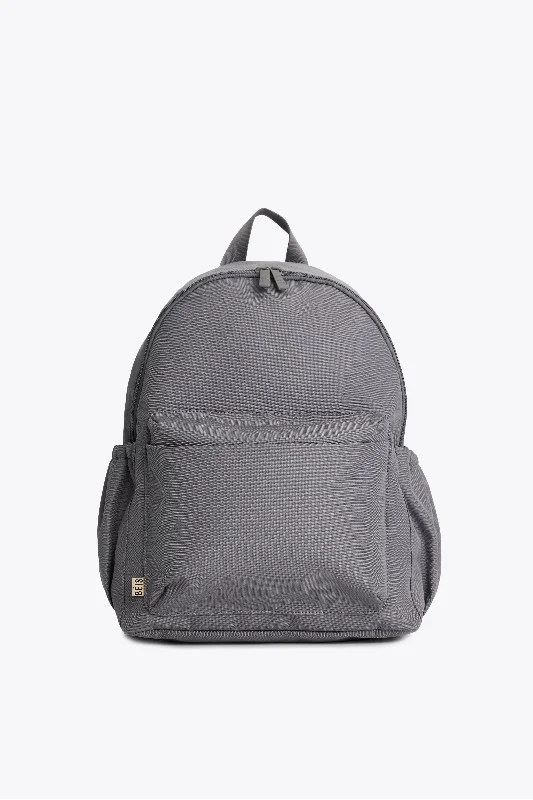 Travel bag with a built - in power bank charger for on - the - go device chargingThe BÉISics Backpack in Grey