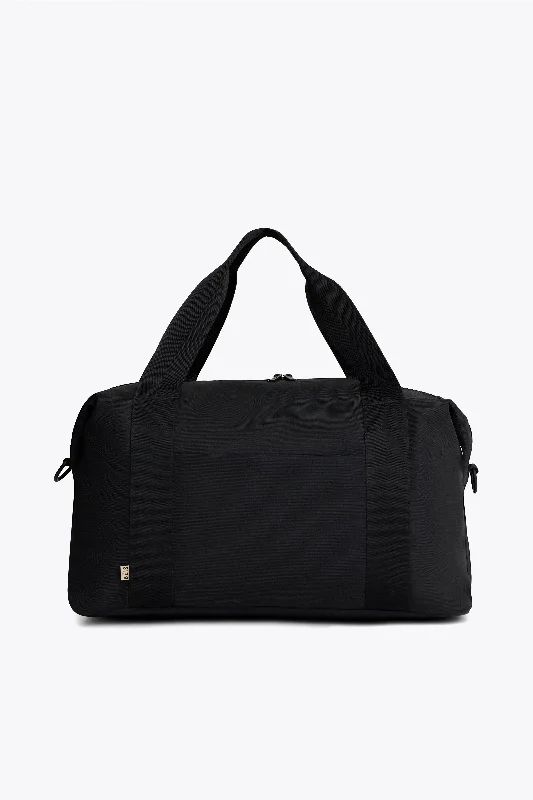 Travel bag with a built - in power bank charger for on - the - go device chargingThe BÉISics Duffle in Black