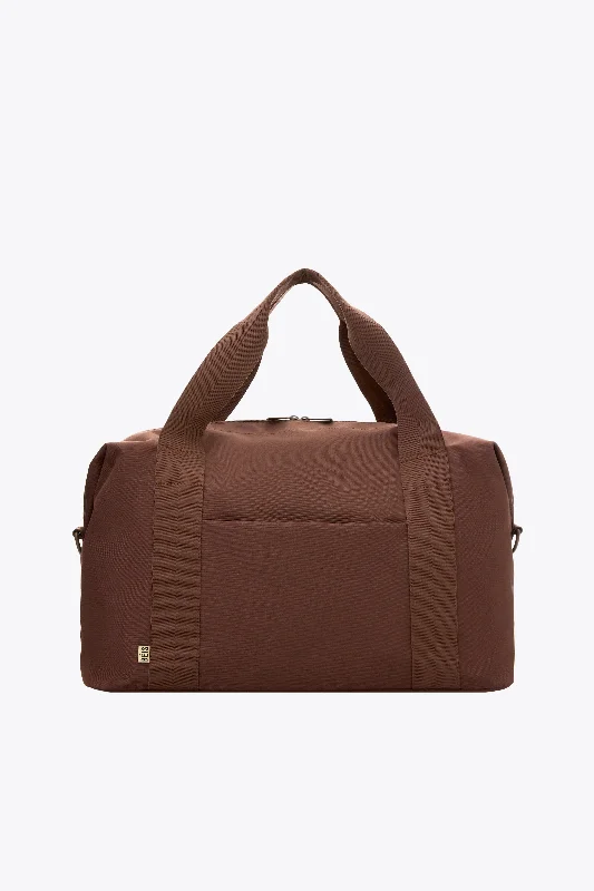 Soft - sided travel bag with reinforced corners for durabilityThe BÉISics Duffle in Maple Soft - sided travel bag with reinforced corners for durabilityThe BÉISics Duffle in Maple