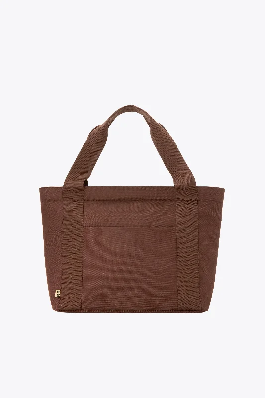 Compact carry - on travel bag with spinner wheels for easy maneuvering in airportsThe BÉISics Tote in Maple Compact carry - on travel bag with spinner wheels for easy maneuvering in airportsThe BÉISics Tote in Maple