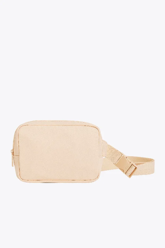 Lightweight nylon duffel travel bag with multiple exterior pockets for quick accessThe Belt Bag in Beige Lightweight nylon duffel travel bag with multiple exterior pockets for quick accessThe Belt Bag in Beige