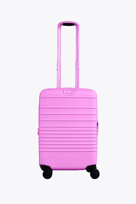 Travel bag with a detachable toiletry pouch for convenienceThe Carry-On Roller in Berry Travel bag with a detachable toiletry pouch for convenienceThe Carry-On Roller in Berry