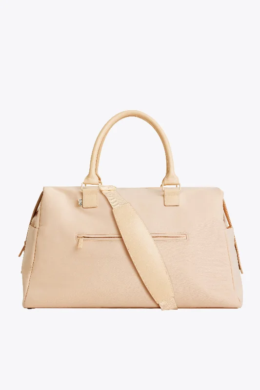 Designer - branded leather travel bag for luxury business travelersThe Commuter Duffle in Beige Designer - branded leather travel bag for luxury business travelersThe Commuter Duffle in Beige