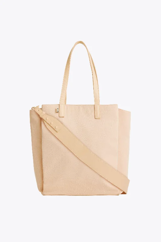 Expandable hard - shell polycarbonate travel bag for long - term international tripsThe Commuter Tote in Beige