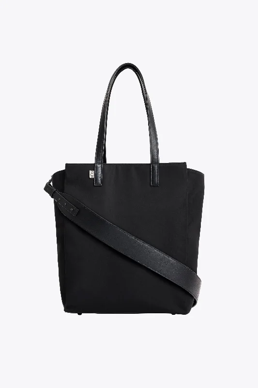 Foldable fabric travel bag for convenient storage when not in useThe Commuter Tote in Black Foldable fabric travel bag for convenient storage when not in useThe Commuter Tote in Black