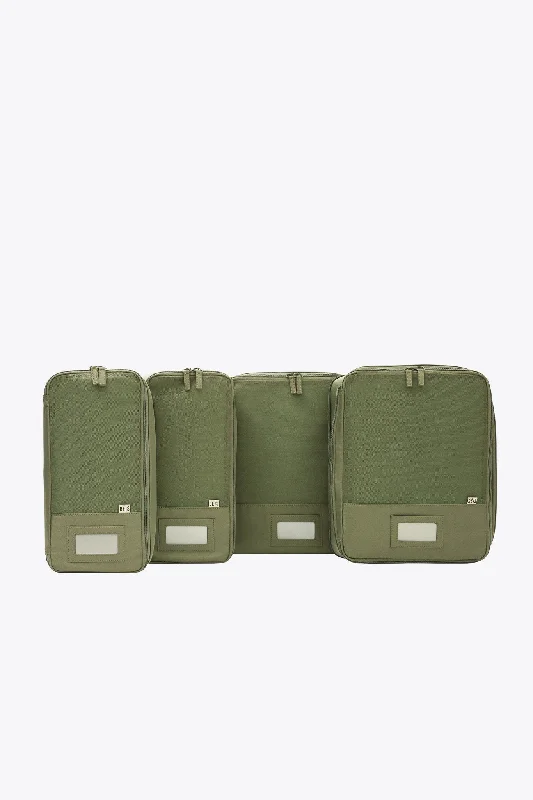 Vintage leather travel bag with brass accents for a classic and sophisticated lookThe Compression Packing Cubes 4 pc in Olive Vintage leather travel bag with brass accents for a classic and sophisticated lookThe Compression Packing Cubes 4 pc in Olive
