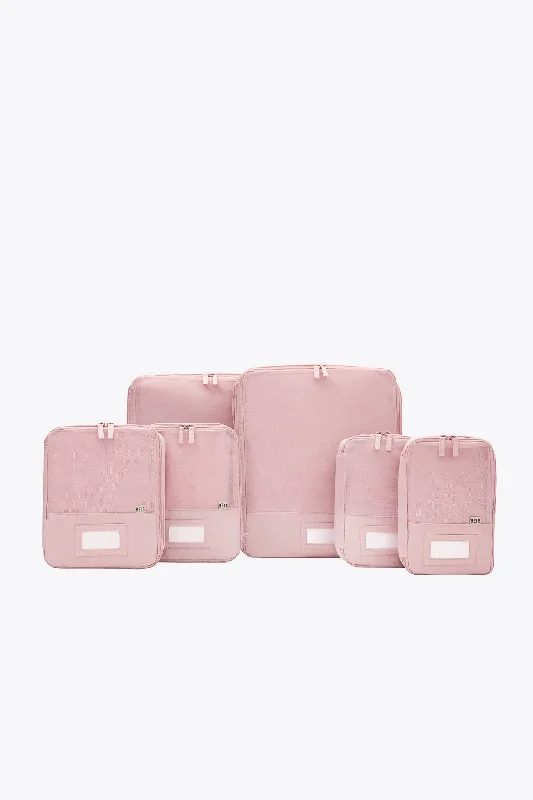 Lightweight nylon duffel travel bag with multiple exterior pockets for quick accessThe Compression Packing Cubes 6 pc in Atlas Pink Lightweight nylon duffel travel bag with multiple exterior pockets for quick accessThe Compression Packing Cubes 6 pc in Atlas Pink
