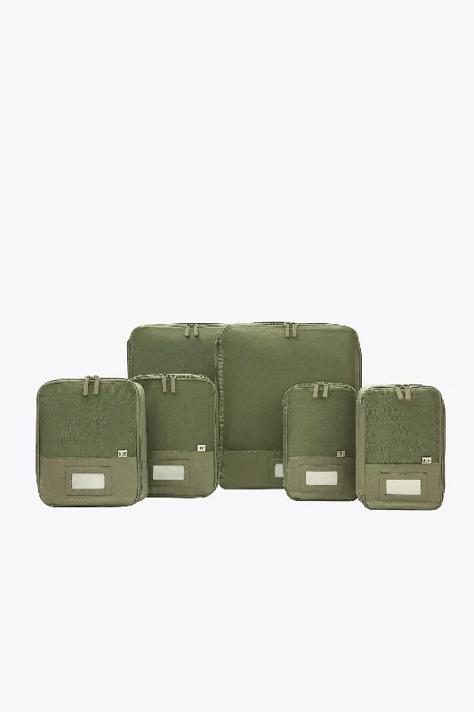 Convertible travel bag that can be used as a backpack or toteThe Compression Packing Cubes 6 pc in Olive Convertible travel bag that can be used as a backpack or toteThe Compression Packing Cubes 6 pc in Olive