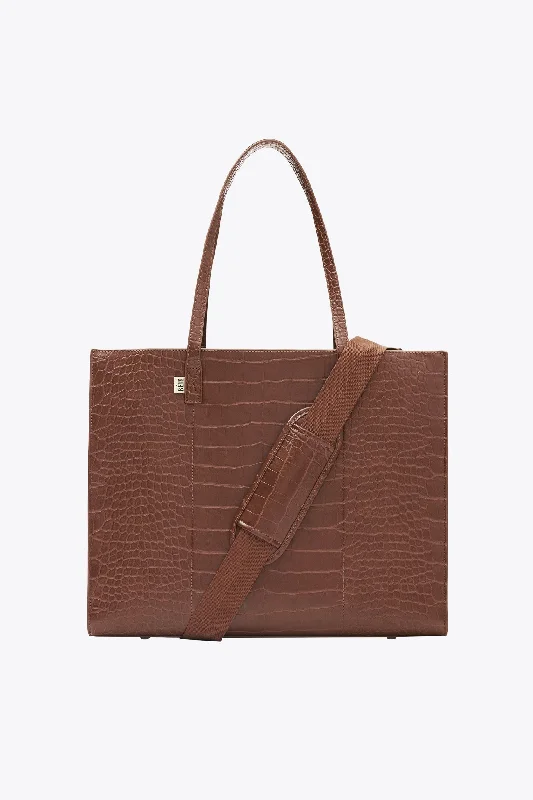 Vintage leather travel bag with brass accents for a classic and sophisticated lookThe Large Work Tote in Maple Croc Vintage leather travel bag with brass accents for a classic and sophisticated lookThe Large Work Tote in Maple Croc