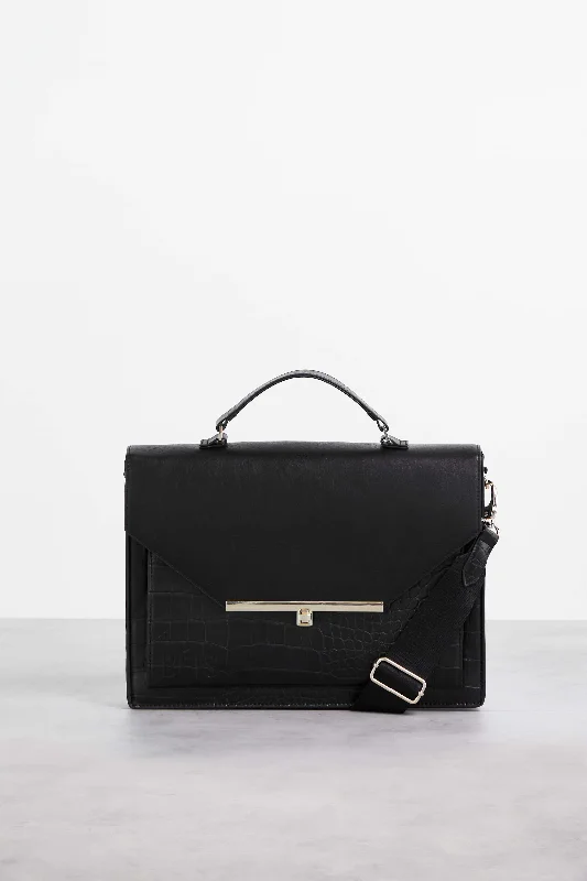 Vintage leather travel bag with brass accents for a classic and sophisticated lookThe Messenger in Black Croc Vintage leather travel bag with brass accents for a classic and sophisticated lookThe Messenger in Black Croc