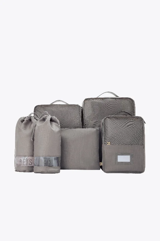 Compact carry - on travel bag with spinner wheels for easy maneuvering in airportsThe Packing Cubes in Grey Compact carry - on travel bag with spinner wheels for easy maneuvering in airportsThe Packing Cubes in Grey