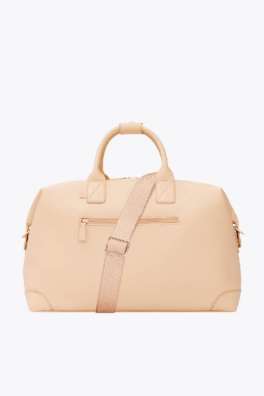 Lightweight nylon duffel travel bag with multiple exterior pockets for quick accessThe Premium Duffle in Beige Lightweight nylon duffel travel bag with multiple exterior pockets for quick accessThe Premium Duffle in Beige