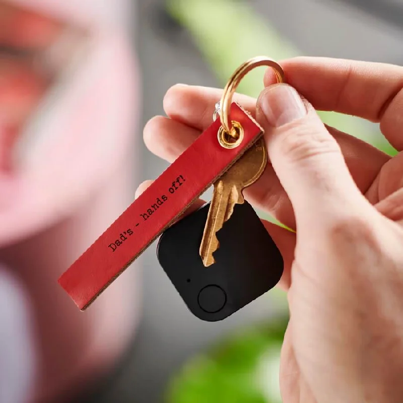 Travel bag with a built - in power bank charger for on - the - go device chargingBluetooth Tracker with Leather Key Ring