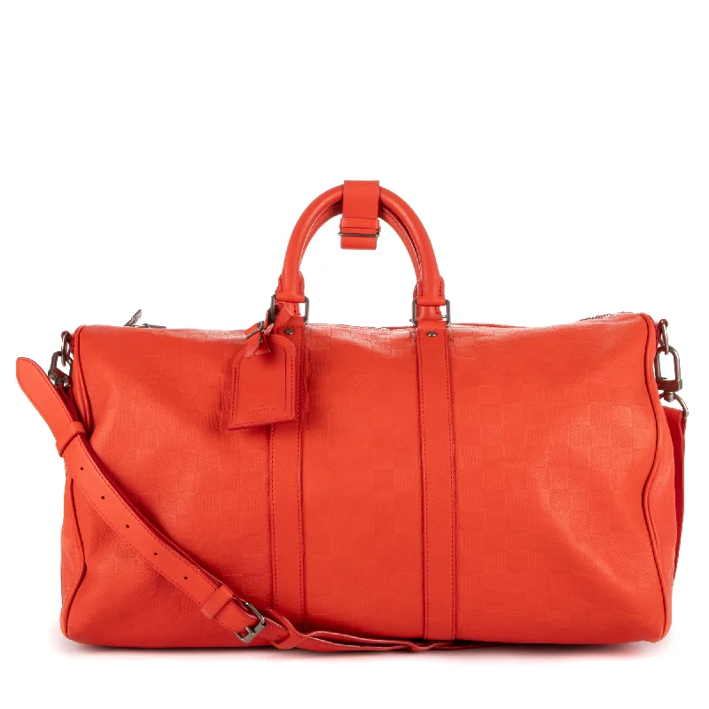 Duffel bags with a built-in shoe compartment to keep shoes separateKeepall Bandouliere 45 Duffel bags with a built-in shoe compartment to keep shoes separateKeepall Bandouliere 45