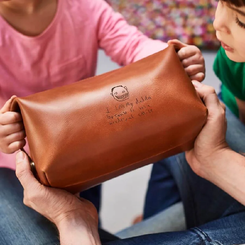 Smart travel bag with integrated GPS tracker for lost item recoveryPersonalised Leather Wash Bag with Child's Masterpiece Smart travel bag with integrated GPS tracker for lost item recoveryPersonalised Leather Wash Bag with Child's Masterpiece