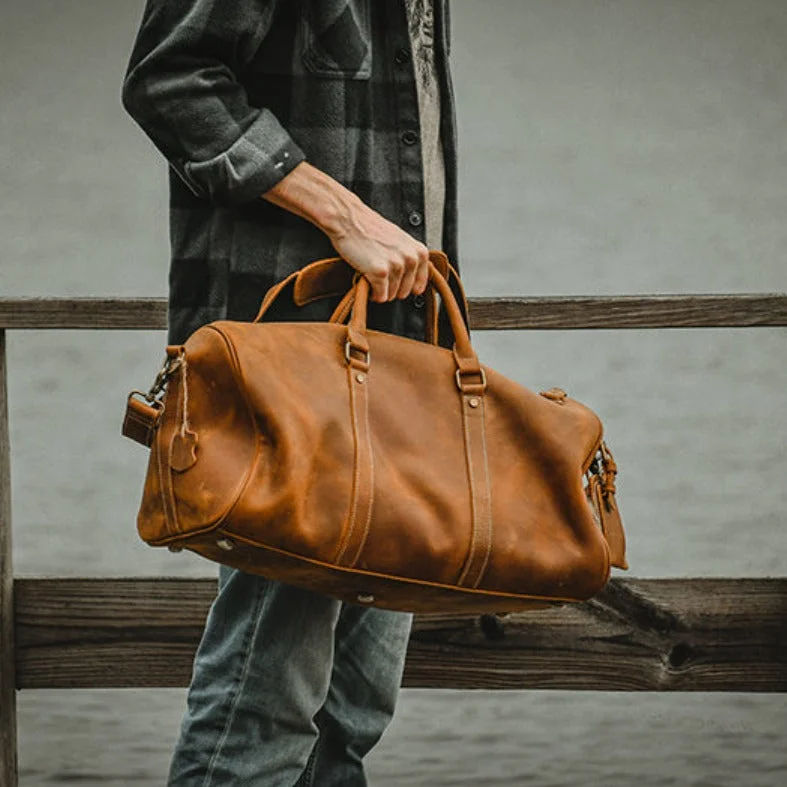 Vintage leather travel bag with brass accents for a classic and sophisticated lookThe Dagny Weekender | Large Leather Duffle Bag Vintage leather travel bag with brass accents for a classic and sophisticated lookThe Dagny Weekender | Large Leather Duffle Bag