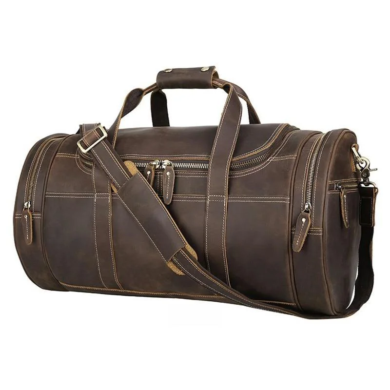 Travel bag with a built - in power bank charger for on - the - go device chargingThe Wainwright Weekender | Round Vintage Leather Weekender Travel bag with a built - in power bank charger for on - the - go device chargingThe Wainwright Weekender | Round Vintage Leather Weekender